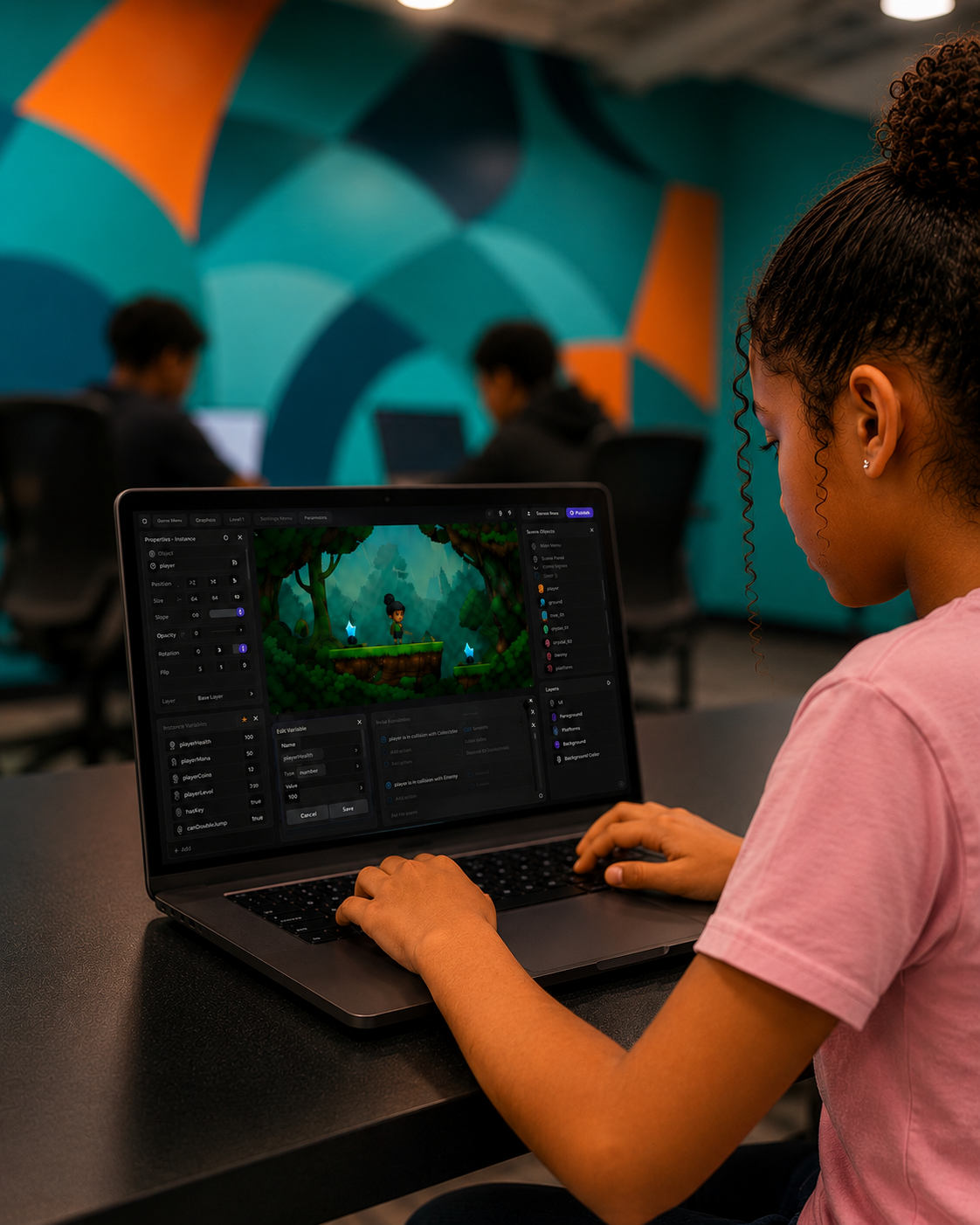 Student building a game on a laptop during Camp Playmaker
